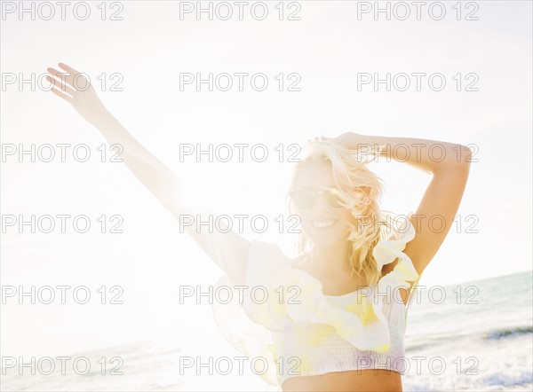 Young woman smiling on beach