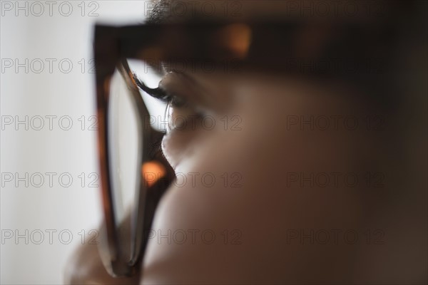 Close up of young woman in nerdy glasses.