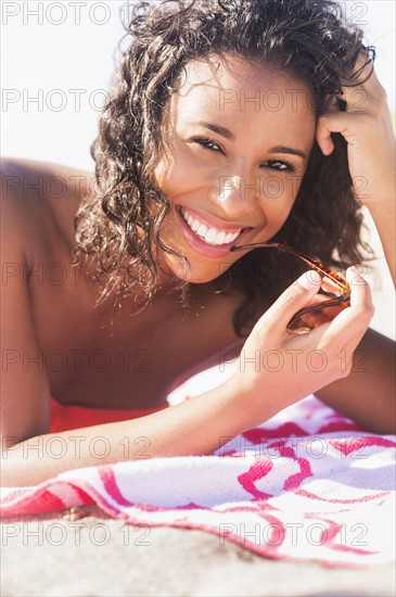 Young woman smiling on beach