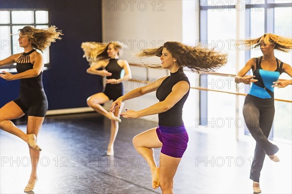 Dancers practicing in dance studio