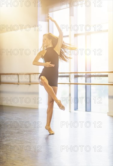 Young woman dancing in dance studio