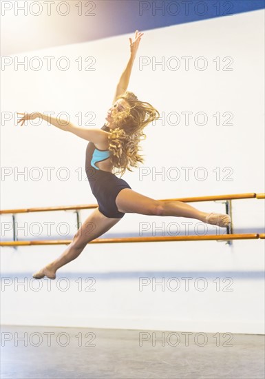 Young woman dancing in dance studio