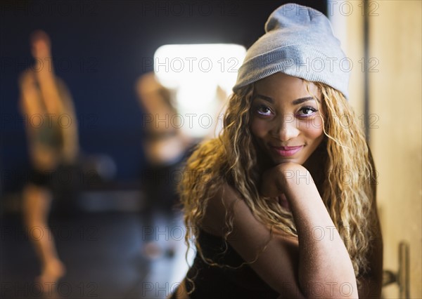 Portrait of female dancer with friends in background