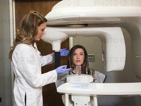 Dentist and patient in dentist's office