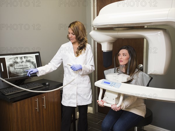 Dentist and patient in dentist's office