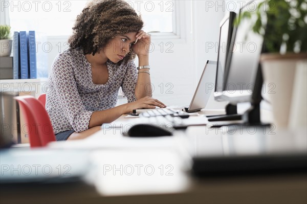 Young woman working at office.