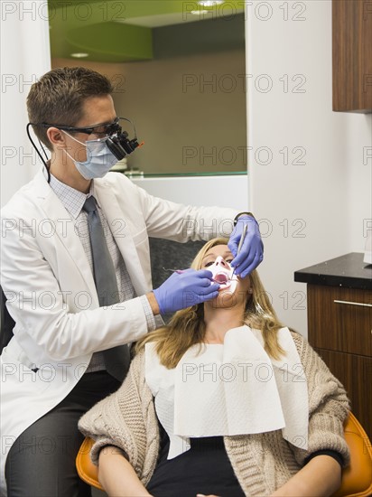 Dentist and patient in dentist's office