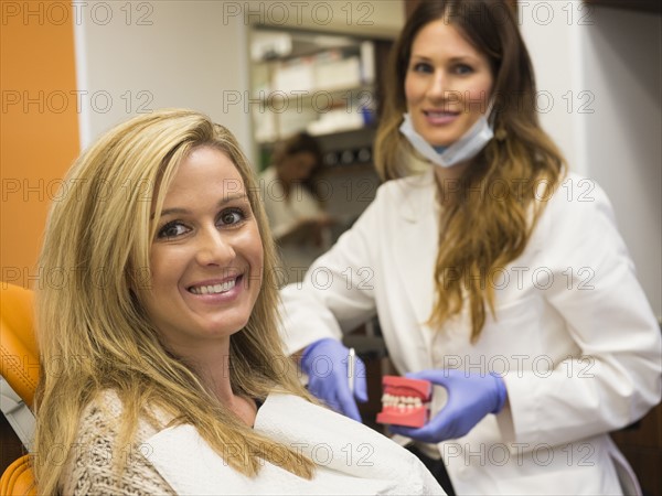 Dentists and patient in dentist's office