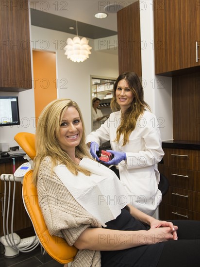 Dentists and patient in dentist's office