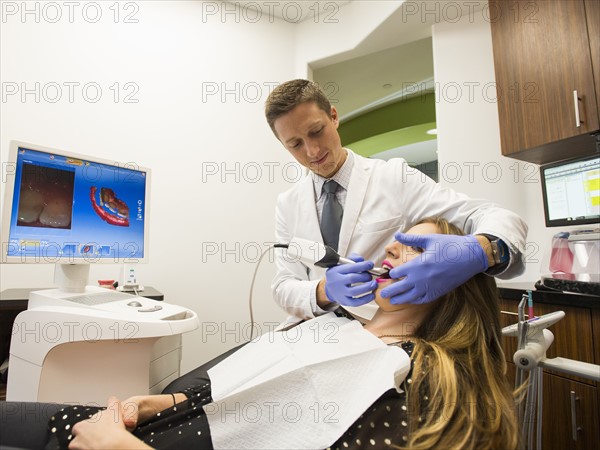 Dentist and patient in dentist's office