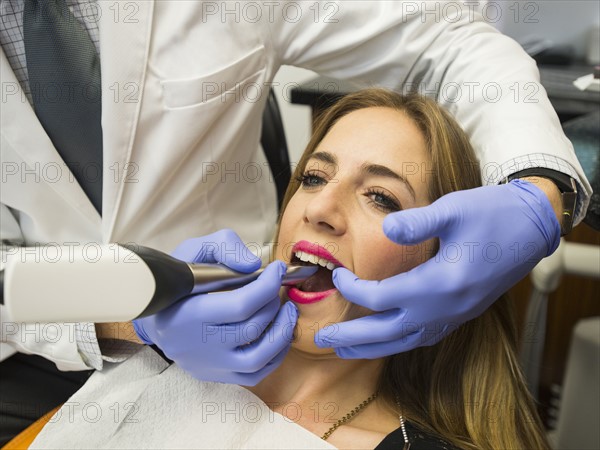 Dentist and patient in dentist's office