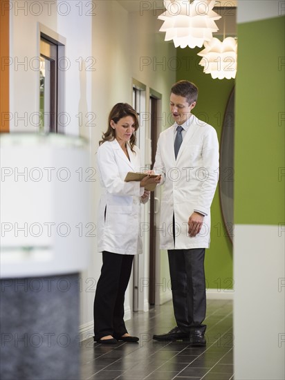 Dentists talking in corridor