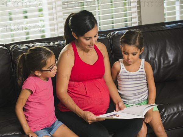 Mother reading to children (6-7, 8-9)