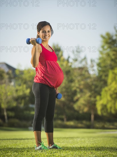 Pregnant woman exercising outdoors