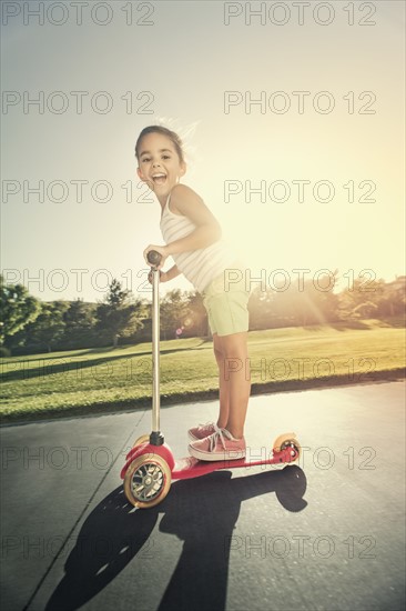 Girl (6-7) playing in park