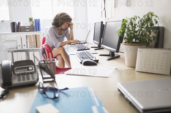 Young woman working at office.