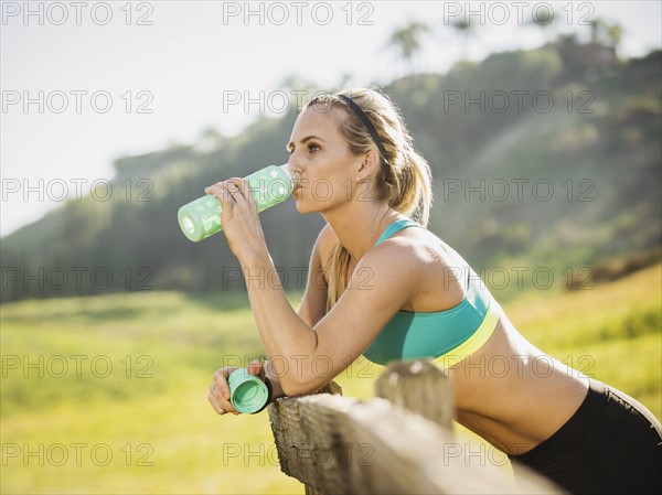 Woman drinking from bottle