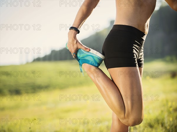 Woman exercising in field