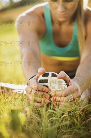 Woman exercising in field