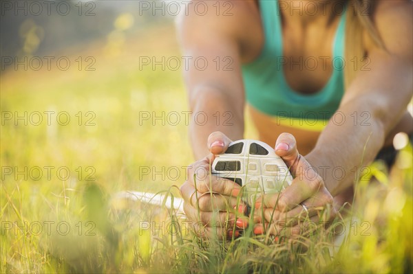 Woman exercising in field