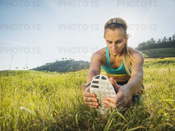 Woman exercising in field