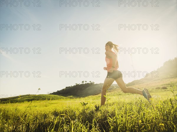 Woman running in field