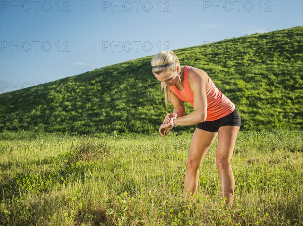 Woman exercising in field