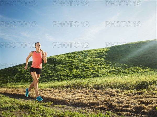 Woman running in field