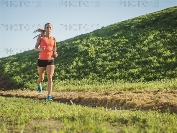 Woman running in field