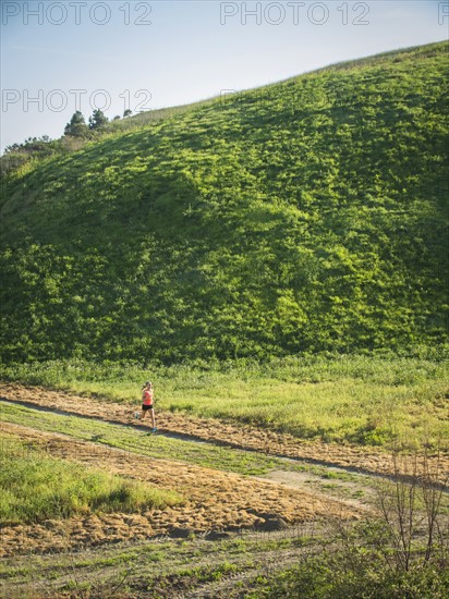 Woman running in field