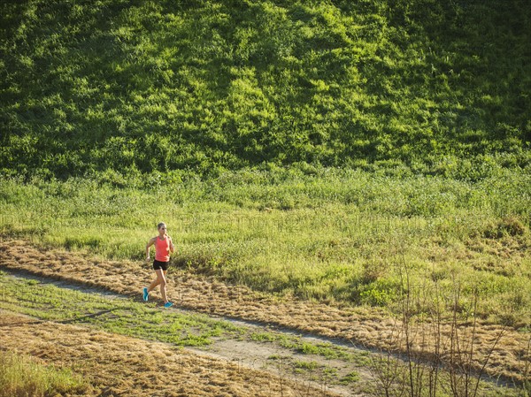 Woman running in field