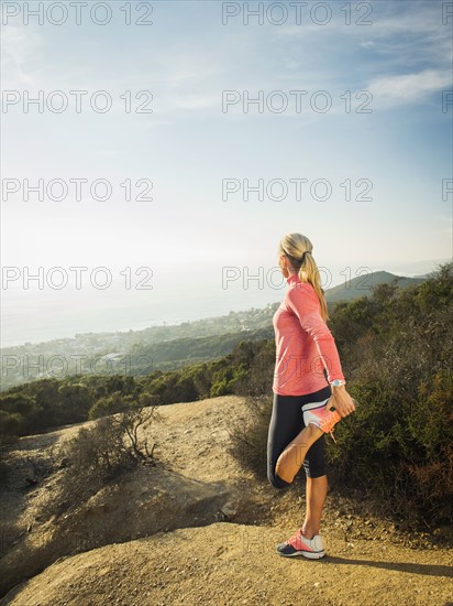 Woman exercising in mountains