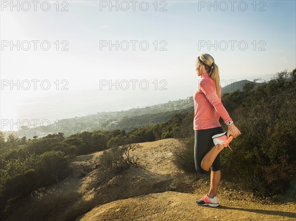 Woman exercising in mountains