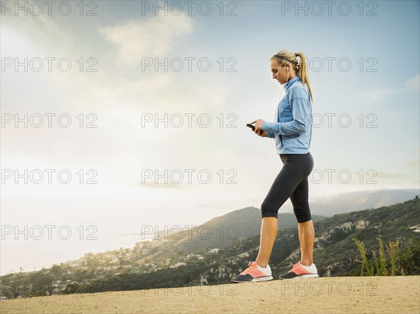 Woman checking smart phone