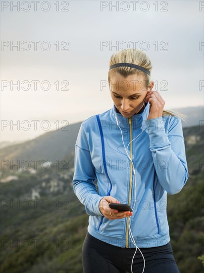 Woman checking smart phone