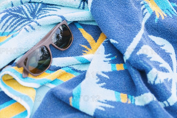 Sunglasses on towel