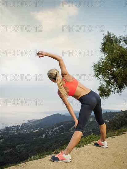 Woman exercising in mountains