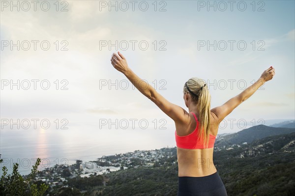 Woman exercising in mountains