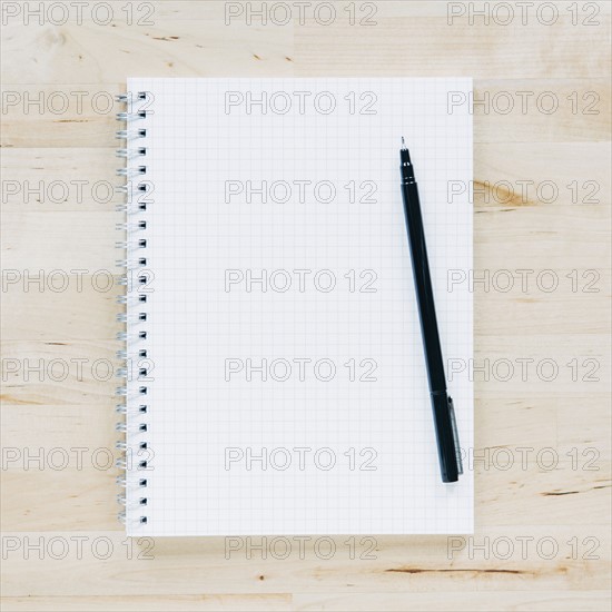 Overhead view of pen on notebook