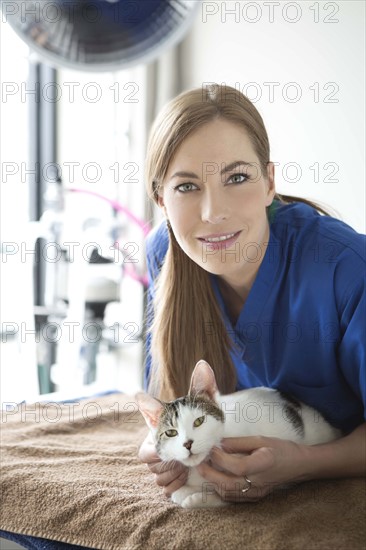 Portrait of vet with cat