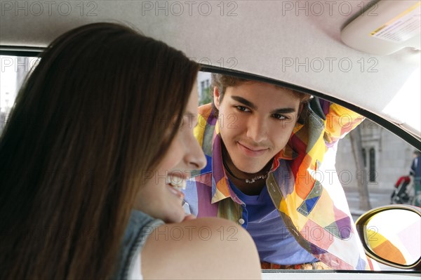 Couple flirting in car