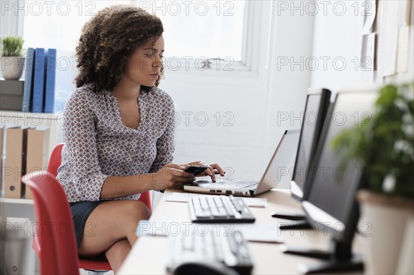 Young woman working at office.