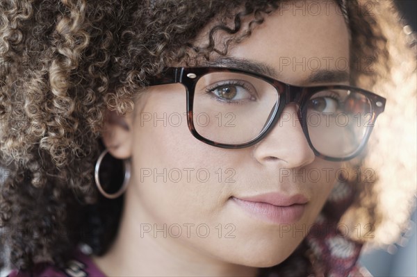 Portrait of woman with curly hair.