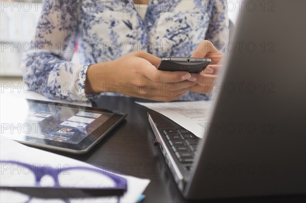 Young woman working in office.