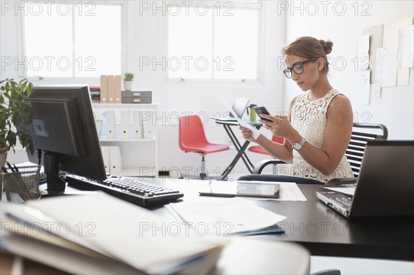 Young woman working in office.