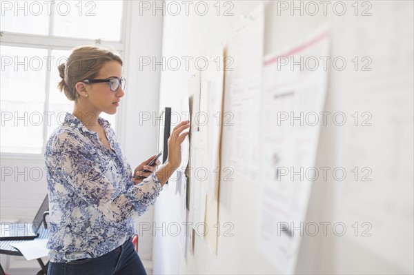 Young woman working in office.