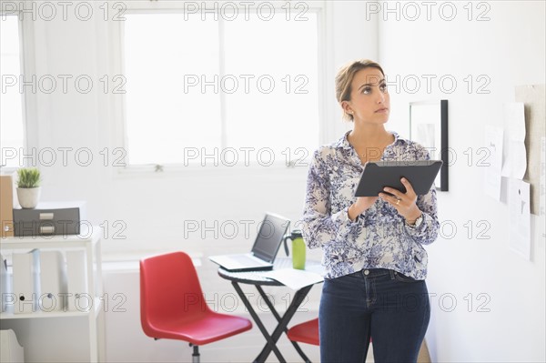 Young woman working in office.