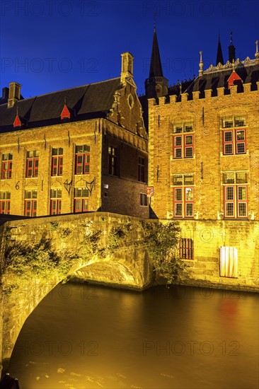 Illuminated townhouses and bridge