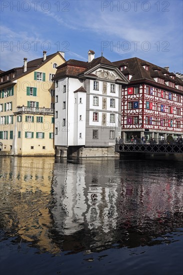 Townhouses reflecting in water