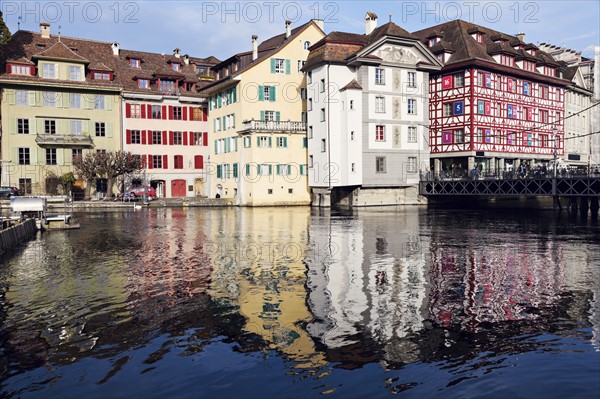 Townhouses reflecting in water